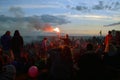 Glastonbury festival, Somerset, UK. 07.01.2014. A crowd waiting for sunrise at the stone circle at Glastonbury festival. W