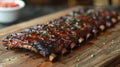 Glazed barbecued ribs on wooden board. Close-up food photography