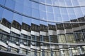 Glazed building that generates strange reflections of the surrounding buildings Royalty Free Stock Photo