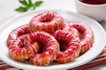 glazed candy cane-shaped cookies on a white plate Royalty Free Stock Photo