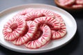 glazed candy cane-shaped cookies on a white plate Royalty Free Stock Photo