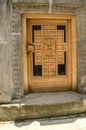 Glazed with carved wooden cross,low entrance door,for bowing the head in the churches of the monastery of Haghartsin,near the to Royalty Free Stock Photo