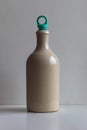 Glazed ceramic bottle with green rubber stopper