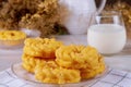 Glazed cruller french donuts with glass of milk on table Royalty Free Stock Photo