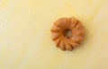 Glazed cruller on a yellow background Royalty Free Stock Photo