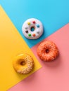 Glazed donuts on colorful background, top view Royalty Free Stock Photo
