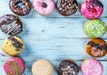 Glazed donuts with different fillings on a blue Royalty Free Stock Photo