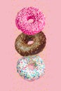 Glazed doughnuts in motion falling on pink background with colorful sprinkles Royalty Free Stock Photo