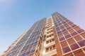 Glazed facade of a multi-storey residential building. Modern apartments in high raised building. Rhythm in photography