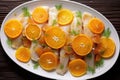 glazed fish fillet with citrus peels arranged creatively