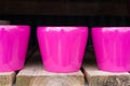 Three glazed pink pots
