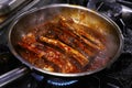 Glazed pork baby ribs in a cooking pan Royalty Free Stock Photo