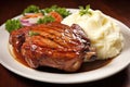 glazed pork chop on a bed of mashed potatoes Royalty Free Stock Photo