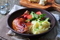 Glazed roasted chicken leg with mashed potatoes and vegetable salad on a wooden background Royalty Free Stock Photo