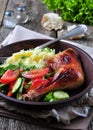 Glazed roasted chicken leg with mashed potatoes and vegetable salad on a wooden background Royalty Free Stock Photo