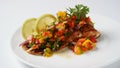 Glazed salmon fillet with mango salsa, herbs and lemon Royalty Free Stock Photo