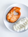 Glazed salmon fillet with rice garnish close-up Royalty Free Stock Photo