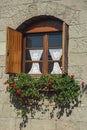 Glazed window with flowers in a country house Royalty Free Stock Photo