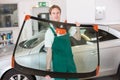 Glazier with car windshield made of glass Royalty Free Stock Photo