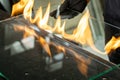 Glazier cuts safety glass, VSG Very Safe Glass The fire burns through the foil connecting the panes Royalty Free Stock Photo