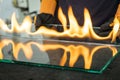 Glazier cuts safety glass, VSG Very Safe Glass The fire burns through the foil connecting the panes Royalty Free Stock Photo