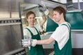 Glazier putting glass in grinding machine Royalty Free Stock Photo