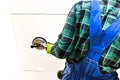 A glaziers worker holding a pane of thick glass in his hands with a special sucker Royalty Free Stock Photo