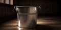 A gleaming silver bucket filled with warm soapy water stands ready to assist in the quest for a spotless home, concept