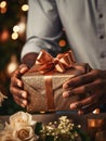 Gleaming Surprise: Man Holding an Elegant Glittering Christmas Gift