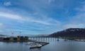 Gleaming Tromso Bridge Reflecting Clouds over the Sea Royalty Free Stock Photo