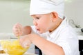 Gleeful young chef baking in the kitchen Royalty Free Stock Photo