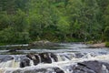 Glen Affric National Nature Reserve, Scotland, UK: Two men fishing on the River Affric Royalty Free Stock Photo