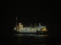 The Glen Lyon FPSO at night during a close pass of a Seismic Vessel in Exploration operations