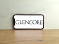 Glencore logo displayed on mobile phone