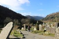 GLENDALOUGH, IRELAND - February 20 2018: The ancient cemetery in monastic site Glendalough. Glendalough Valley, Wicklow Mountains Royalty Free Stock Photo