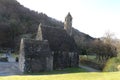 GLENDALOUGH, IRELAND - February 20 2018: The ancient cemetery in monastic site Glendalough. Glendalough Valley, Wicklow Mountains Royalty Free Stock Photo