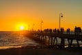 Glenelg Beach jetty full of people at sunset Royalty Free Stock Photo