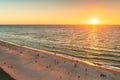 Glenelg beach with people at sunset