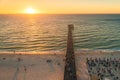 Glenelg beach with people walking along the jetty at sunset Royalty Free Stock Photo