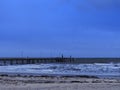 Glenelg jetty and beach under the storm with thick cloud and blue tone