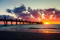 Glenelg pier with walking people silhouettes at sunset Royalty Free Stock Photo