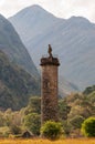 The Glenfinnan Monument, a tall column, topped by a statue of s kilted Highlander, in Glenfinnan, Scotland Royalty Free Stock Photo