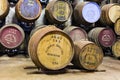 Aging old wooden barrels and casks in cellar at whisky distiller