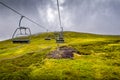 Glenshee Mountain Ski Centre and Snowsports School with chairlift and cafe on a misty cloudy day