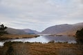 Glenveagh National Park, Co. Donegal. view of lake between mountains. Mountain scene with cloudy sky