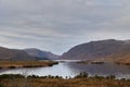 Glenveagh National Park, Co. Donegal. view of lake between mountains. Mountain scene with cloudy sky