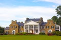 Glenview historic mansion with formal gardens at sunset.