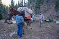 Hunters gear up and saddle up horses to pack out after an elk hunting trip