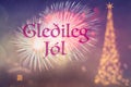 GleÃÂ°ileg JÃÂ³l means Merry Christmas in Icelandic. Blurred background of decorated Christmas tree with golden lights. Fireworks.