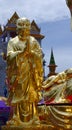 The glided statue of bodhisatva in front of Wat Traimit also known as Golden Buddha temple, Bangkok, Thailand